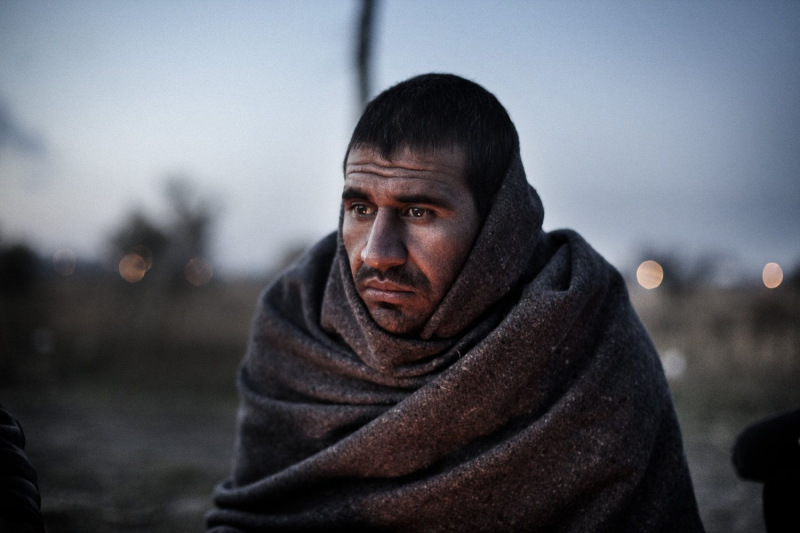 Daniel Etter: Yousuf Zai Firuz, an Afghan refugee, sits by a fire outside Subotica, Serbia, Nov. 9, 2012. Many illegal immigrants try to get from Greece through the Balkans to northern parts of the European Union. Recently, Serbian police deported many refugees from here to Macedonia.