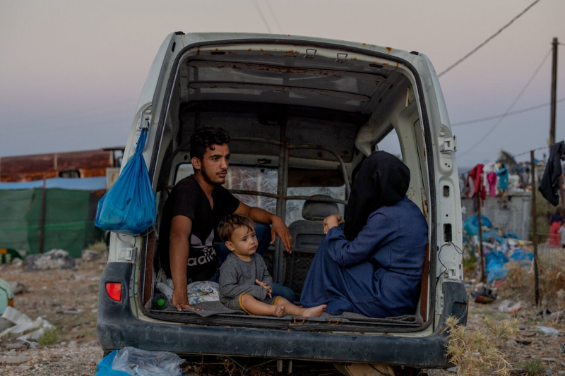 Daniel Etter: Syrian refugees Muhammed, Omar and Usra Al Hassida rest in a car that they have made their temporary shelter, Mytilini, lesbos, Greece, Sept. 13, 2020. Thousands of people, mostly families from Afghanistan, remained stranded on a road after a  fire burned down a camp in the nearby village of Moria, which was used to house asylum seekers and process their applications. Before it burned down the so-called hotspot in Moria was overcrowded and many asylum seekers remained stuck there for months.
